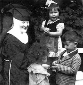 Sister M.I. Hummel with three cildren